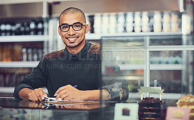 Buy stock photo Portrait of a man standing behind the counter in a coffee shop
