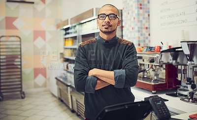 Buy stock photo Shot of a young man in a coffee shop