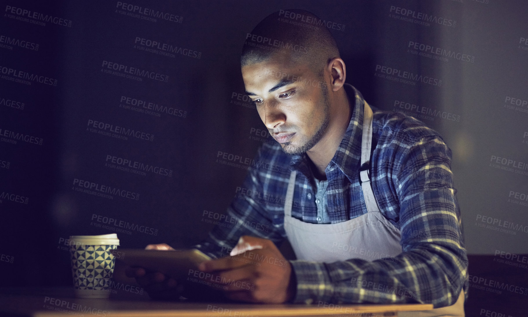 Buy stock photo Small business, dark and man in cafe, tablet and social media with typing, connection and night. Person, entrepreneur and barista with technology, evening and communication with website info and app