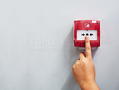 Buy stock photo Cropped shot of a person pressing a fire alarm on a wall