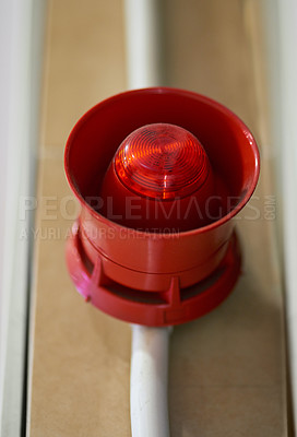 Buy stock photo Emergency, siren and speaker for fire alarm, warning and evacuation with safety regulations or compliance. Red light on wall for security alert, noise and danger with sound, electricity and risk