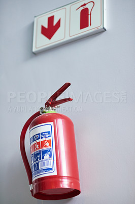 Buy stock photo Fire extinguisher, wall and sign for firefighting, action and safety with emergency help and support. Portable dry and chemical powder to stop flame, air and oxygen for building equipment and arrow