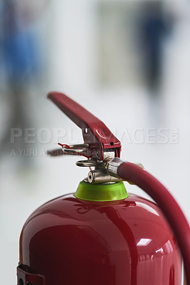 Buy stock photo Cropped shot of a fire extinguisher