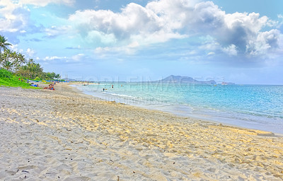 Buy stock photo A gorgeous beach, relaxing summer seascape for a peaceful holiday with cloudy sky copyspace. Calming waves washing onto sandy shore on tropical, exotic resort. Travel concept or wallpaper background 