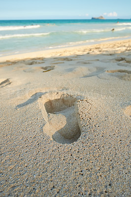 Buy stock photo Copy space landscape and seascape of footprints in the sand on a tropical beach in summer. Closeup of a footstep on the beach shore on holiday. One footmark imprinted on the seashore on vacation