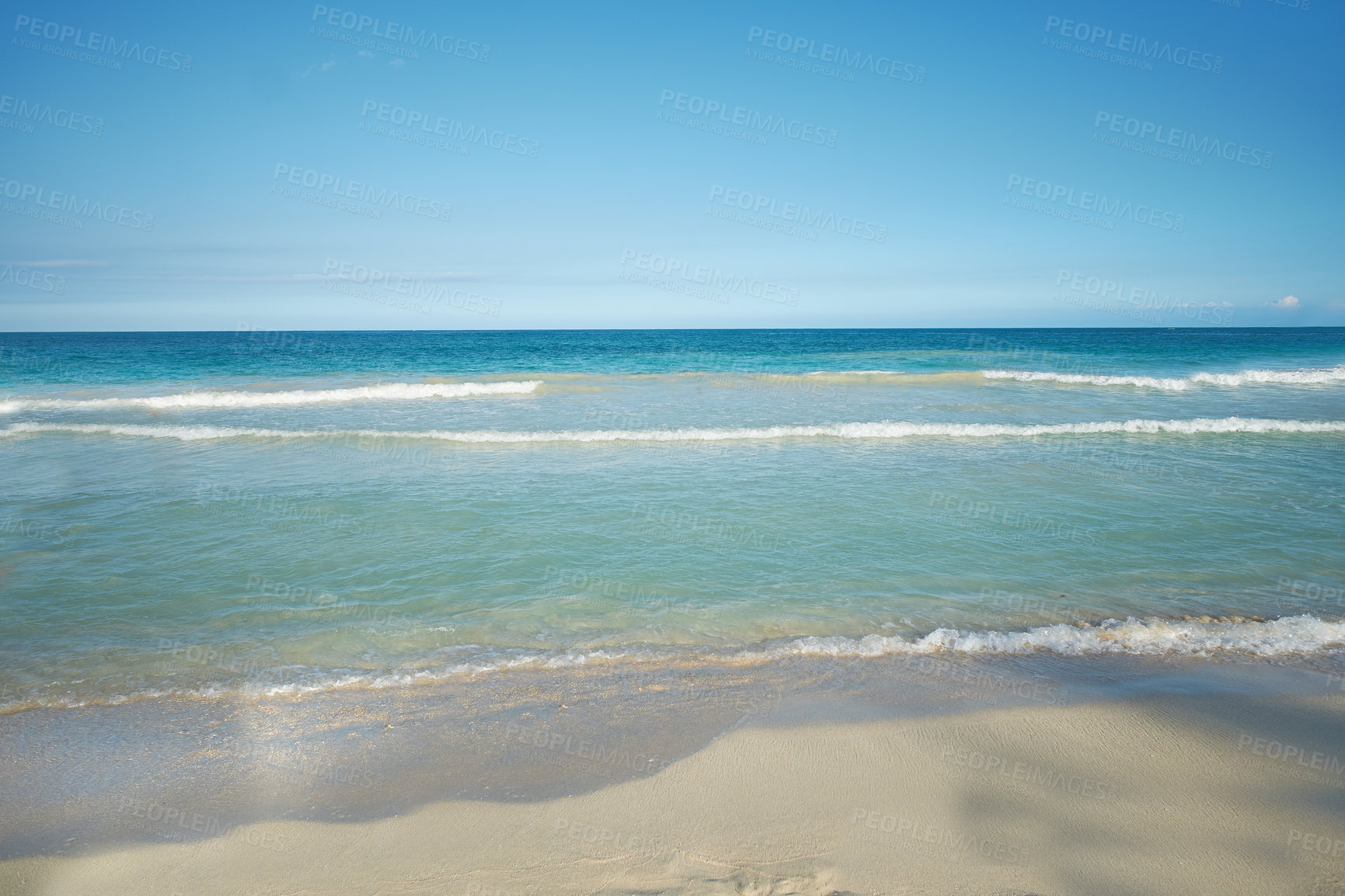 Buy stock photo Copyspace landscape and seascape of waves washing onto a seashore on a tropical beach in summer in nature. Beautiful texture of a wave reaching the sandy beach shore. View of the seaside and blue sky