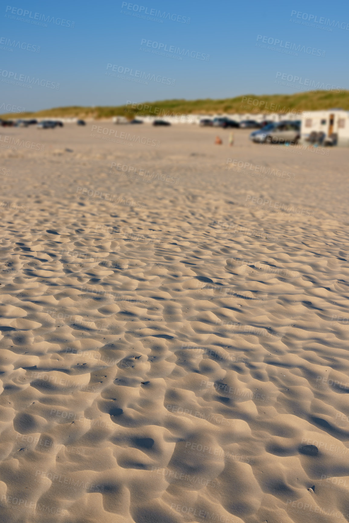 Buy stock photo Landscape view of beach sand with windy weather texture, copyspace on summer's day. Scenic dunes formed by coastal or tidal gust winds. People enjoying relaxing holiday, vacation abroad and overseas