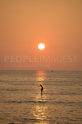 Buy stock photo Beach, person and paddle board with ocean, sunset and travel with vacation, Waikiki and getaway trip. Honolulu, tourist and traveller with recreation, seaside and activity with waves and adventure