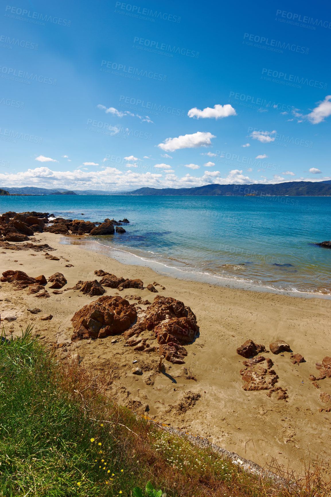 Buy stock photo Landscape, sand and rock with beach and ocean for environment, travel destination and tropical. Summer vacation, water and nature with sea horizon for mediterranean coastline, holiday and paradise