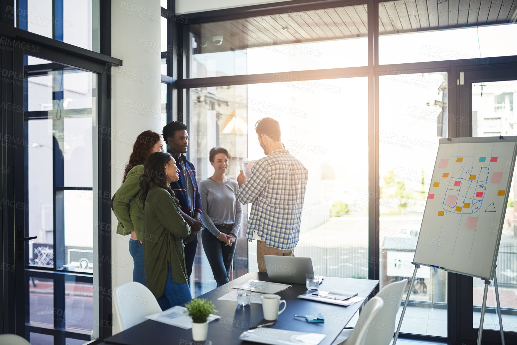 Buy stock photo Shot of a group of colleagues having an office meeting