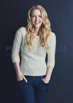 Buy stock photo Studio portrait of a smiling young woman isolated on black
