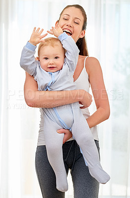 Buy stock photo Mother, baby and hands with smile in portrait for bond, learning and development with time management. Mom, child and together in house for motor skills or wellness, happiness in home or living room
