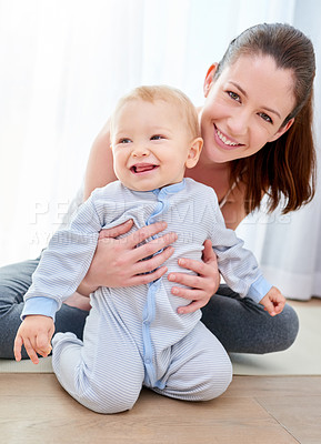 Buy stock photo Shot of a mom bonding with her baby