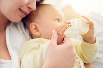 Buy stock photo Mother, formula and baby drinking with bottle for nutrition, growth and childhood development at home. Care, infant and mom with feeding milk in house for love, motherhood and parenting of boy kid