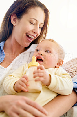Buy stock photo Bottle, love or mother with baby in home drinking milk for wellness with kid, care or food nutrition. Parent, woman or happy single mom in family house for bonding, diet or feeding with newborn child