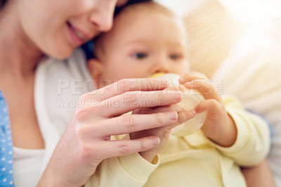 Buy stock photo Bottle, hands or mother with baby in home drinking milk for wellness with kid, care or food nutrition. Parent, woman or single mom in family house for bonding, formula or feeding with newborn child