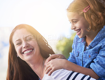 Buy stock photo Shot of a mother giving her daughter a piggyback ride