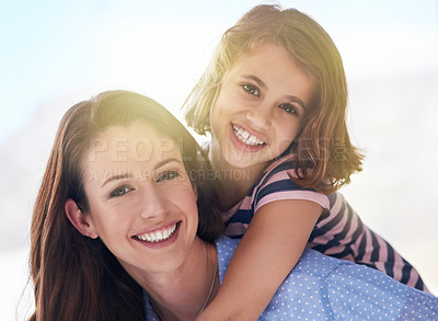 Buy stock photo Mother, girl and piggyback in portrait for outdoor games, excited and fun in sun for bonding, love and support. Happy family or parent playing with child wellness in nature for adventure or travel