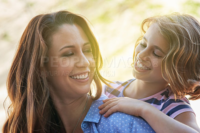 Buy stock photo Shot of a mother giving her daughter a piggyback ride