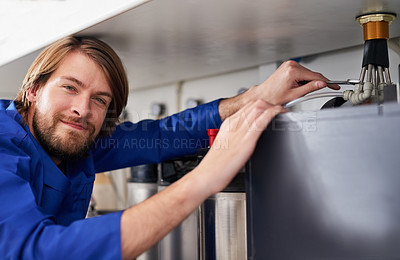 Buy stock photo Portrait of a skilled handyman repairing a water heater