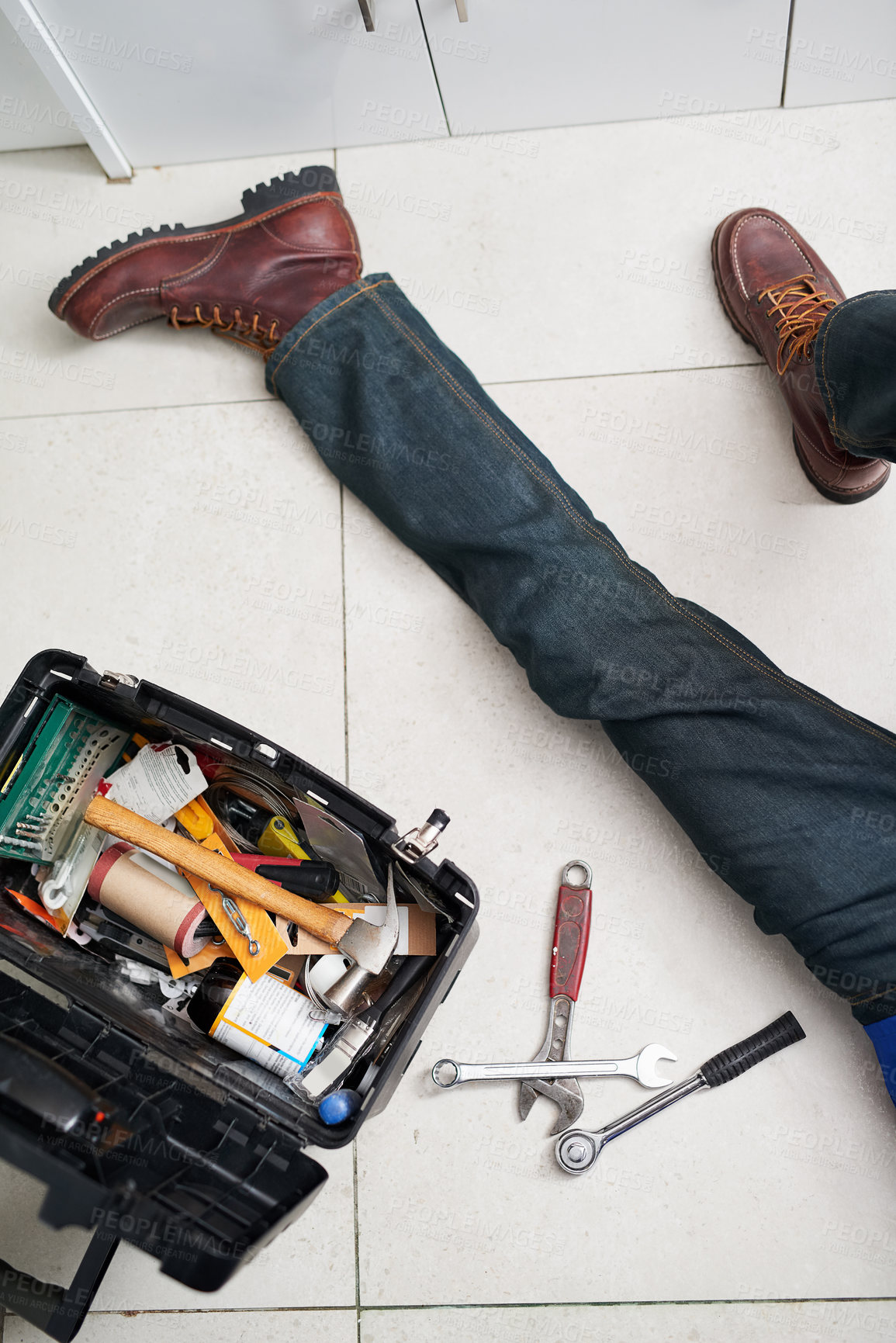Buy stock photo Man, plumbing and tools in box on floor with maintenance for construction, inspection or repair in home. Plumber, contractor and handyman with equipment for renovation, upgrade or service from above