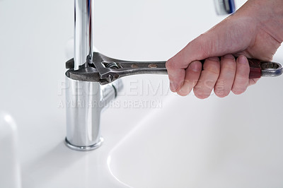 Buy stock photo Handyman, plumbing and tools in kitchen sink with wrench, pipes and repair at work and job in home. Male person, artisan and worker for client in house for fitting, installing or fixing water system