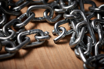 Buy stock photo Shot of metal chains with a broken link