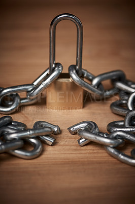 Buy stock photo Shot of a broken metal chain tied to a lock