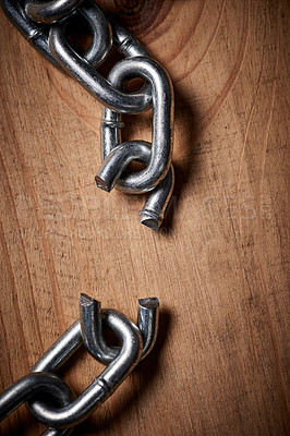 Buy stock photo Shot of metal chains with a broken link