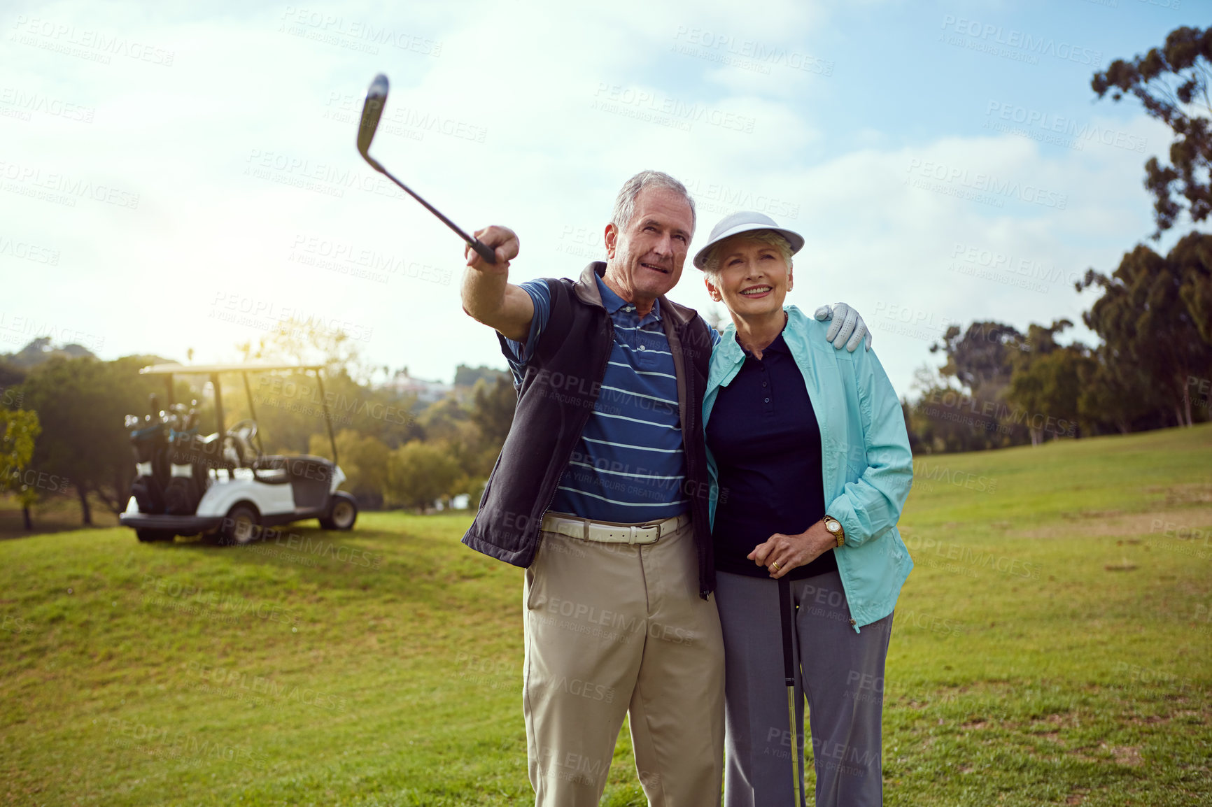 Buy stock photo Golf, hobby and pointing with senior couple outdoor on course together for leisure activity. Grass, love and retirement with happy old people playing sports for bonding or recreation in summer