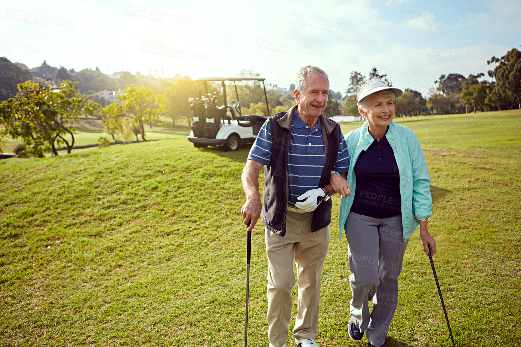 Buy stock photo Golf, retirement and walking with senior couple outdoor on course together for leisure activity. Grass, hobby and mockup space with old people playing sports for bonding or recreation in summer