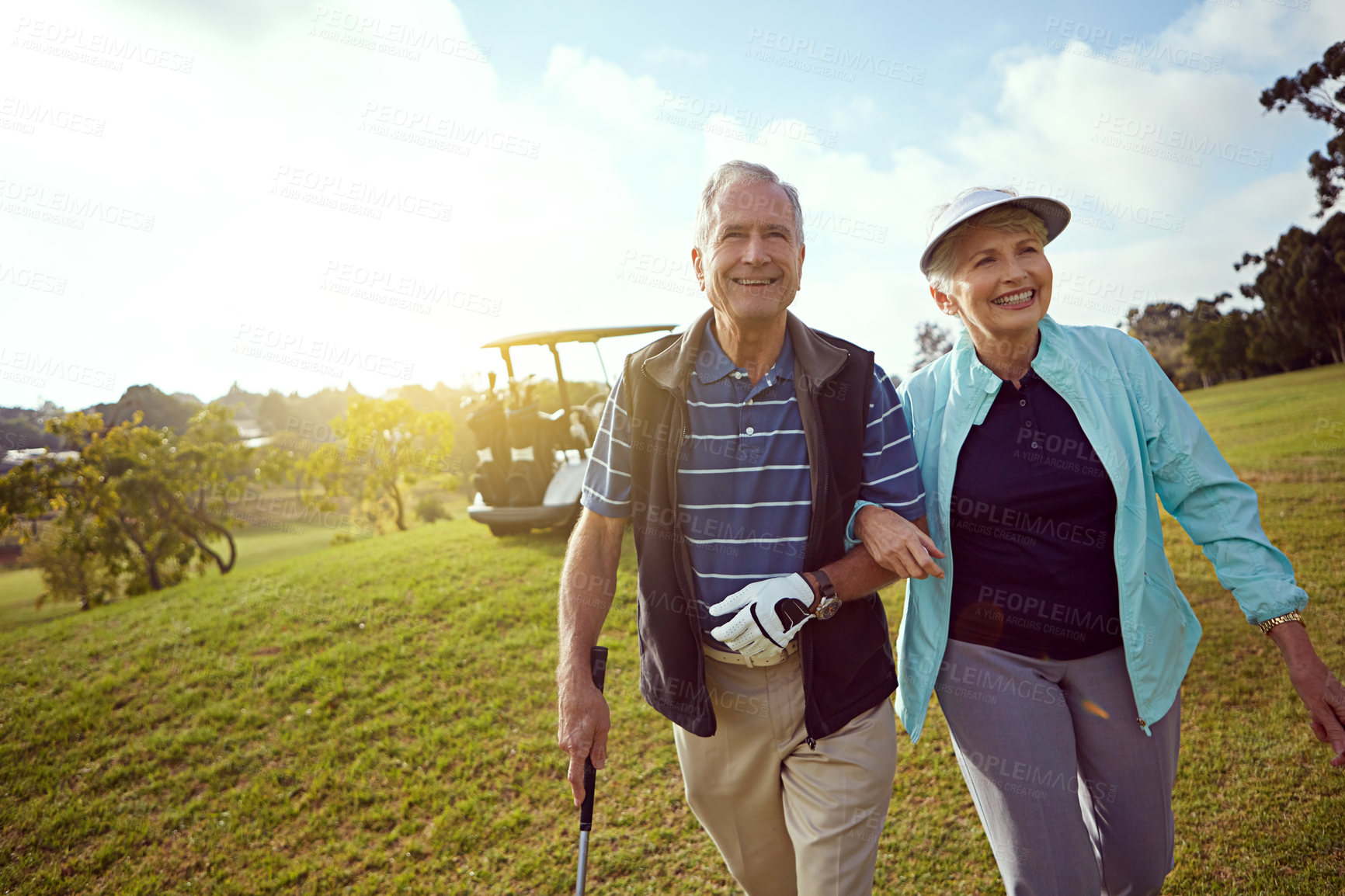 Buy stock photo Golf, retirement and walking with old couple outdoor on course together for leisure activity. Grass, mockup space and smile with senior people playing sports for bonding or recreation in summer