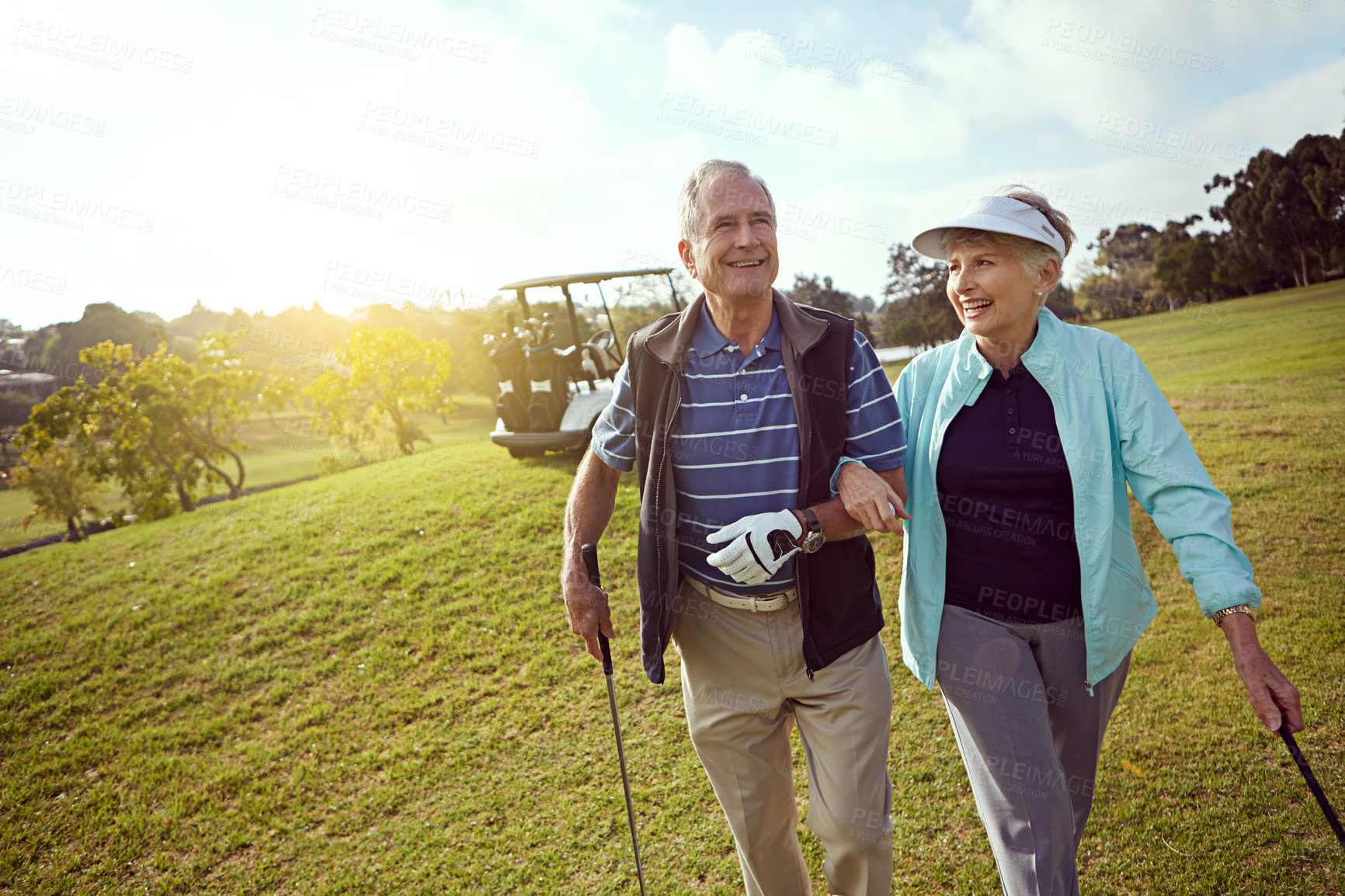 Buy stock photo Retirement, smile and walking with old couple on golf course together for leisure activity. Hobby, love and space with happy senior people playing sports for bonding, recreation or romance in summer