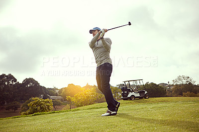 Buy stock photo Full length shot of a young man playing golf