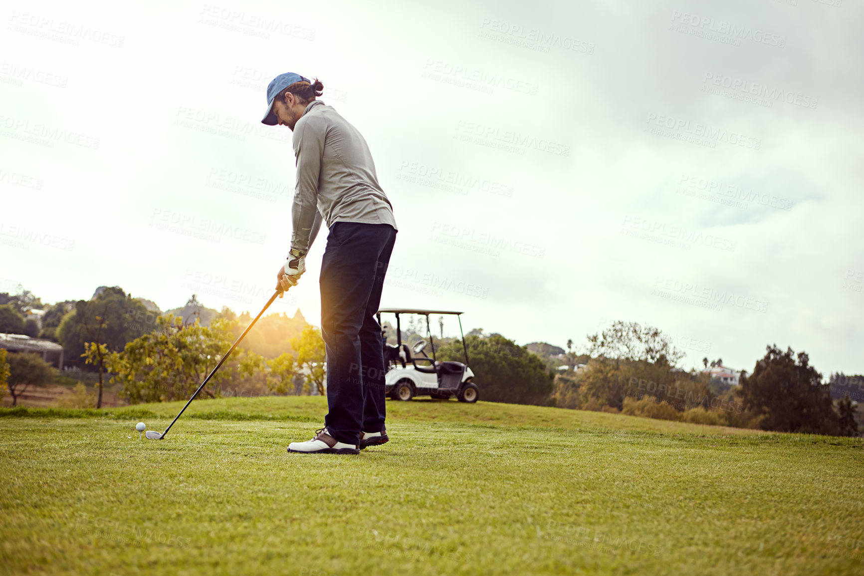 Buy stock photo Man, fitness and play golf on field for sports, hobby and training with recreation, exercise and fun. Male person, golfer and strike club on outdoor course for competition, workout and practice game