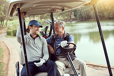 Buy stock photo Shot of a senior man and his adult son riding in a cart on a golf course