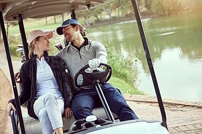 Buy stock photo Couple, fun and golf cart for sports, exercise and drive with weekend hobby, bonding and fitness. People, together and smile on course for support, game and club competition with leisure