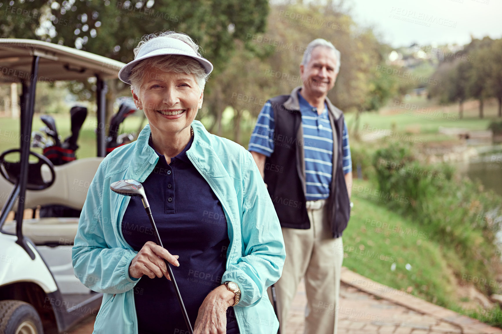 Buy stock photo Portrait of a smiling senior couple enjoying a day on the golf course