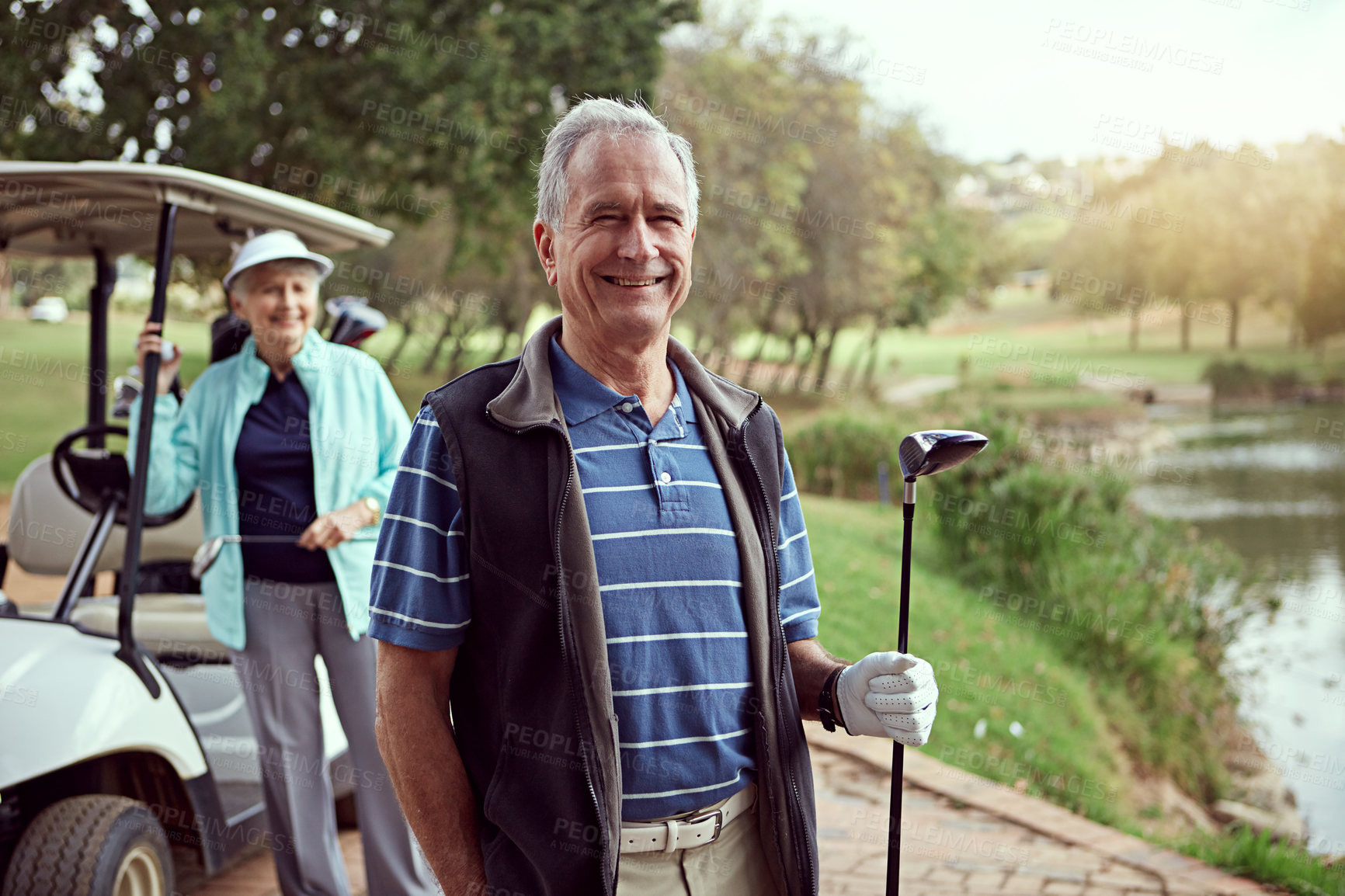 Buy stock photo Portrait of a smiling senior couple enjoying a day on the golf course