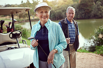Buy stock photo Portrait of a smiling senior couple enjoying a day on the golf course