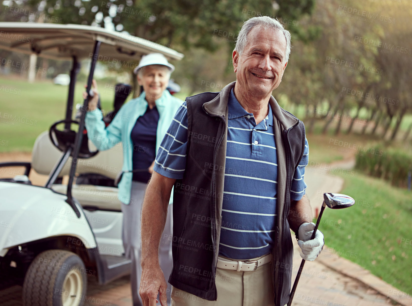 Buy stock photo Portrait of a smiling senior couple enjoying a day on the golf course