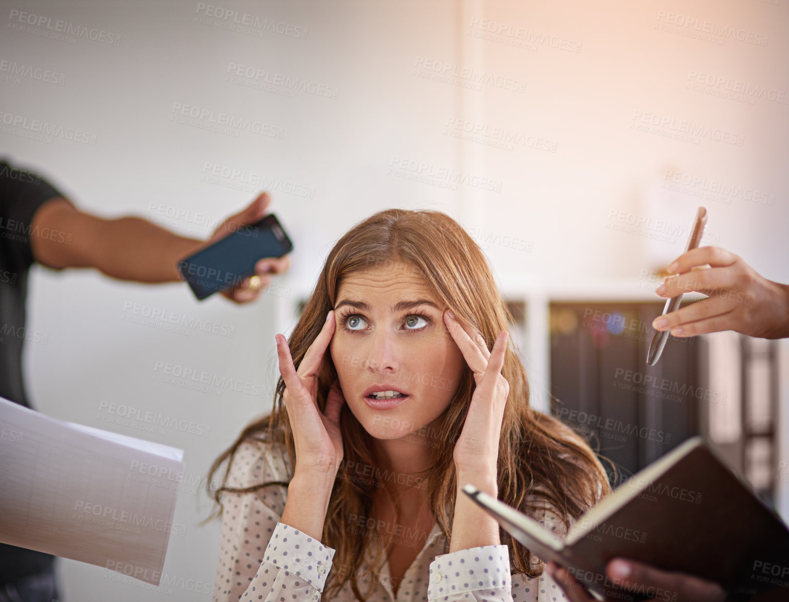 Buy stock photo Cropped shot of an anxious looking businesswoman surrounded by hands reaching in holding office items