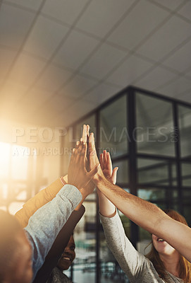 Buy stock photo Shot of a group of colleagues giving each other a high five