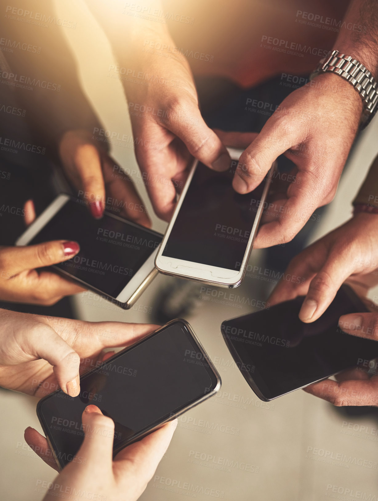 Buy stock photo Business people, circle and hands with phone screen in office for communication, networking or sync schedule. Closeup, lens flare and employees with display for teamwork, data transfer or meeting