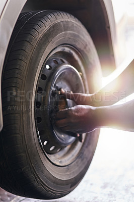 Buy stock photo Tyre, hands and mechanic in garage for repairs, rubber and fixing or replace fitting on car at shop. Closeup, person and service or safety check inspection, motor and alignment of vehicle to change