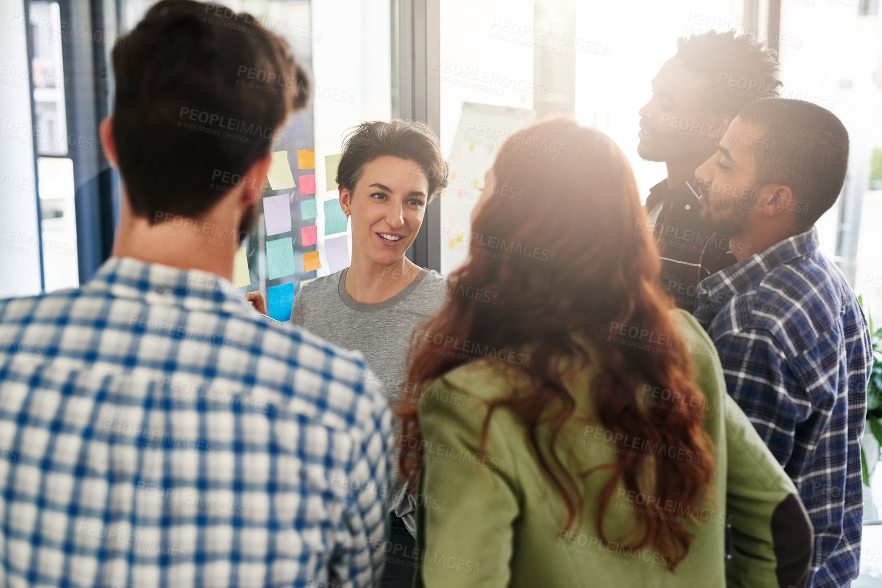 Buy stock photo Meeting, team and business people planning on glass wall for solution, brainstorming or pitch startup ideas. Sticky note, happy group or collaboration with creative director for campaign design