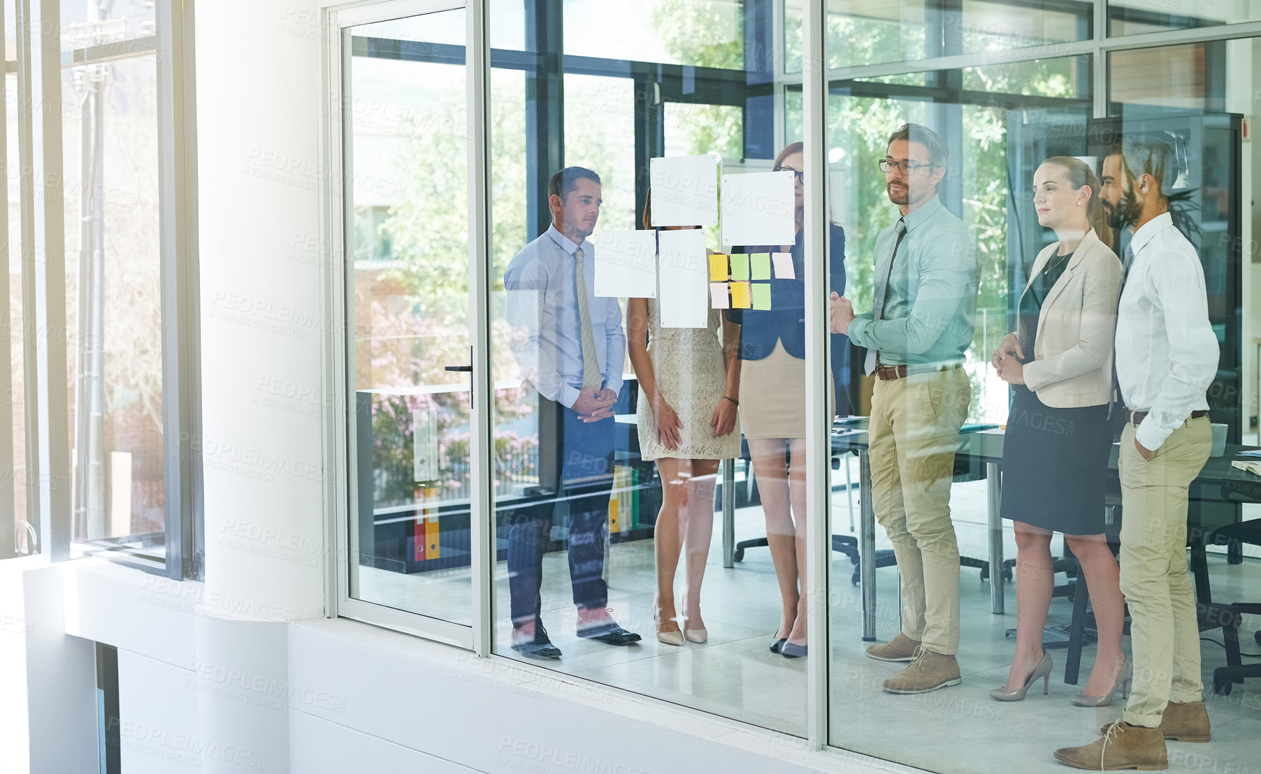 Buy stock photo Business people, glass wall and presentation paper with manager for feedback, review and training workshop. Diversity, board and teamwork for project brief collaboration, planning and mentor advice