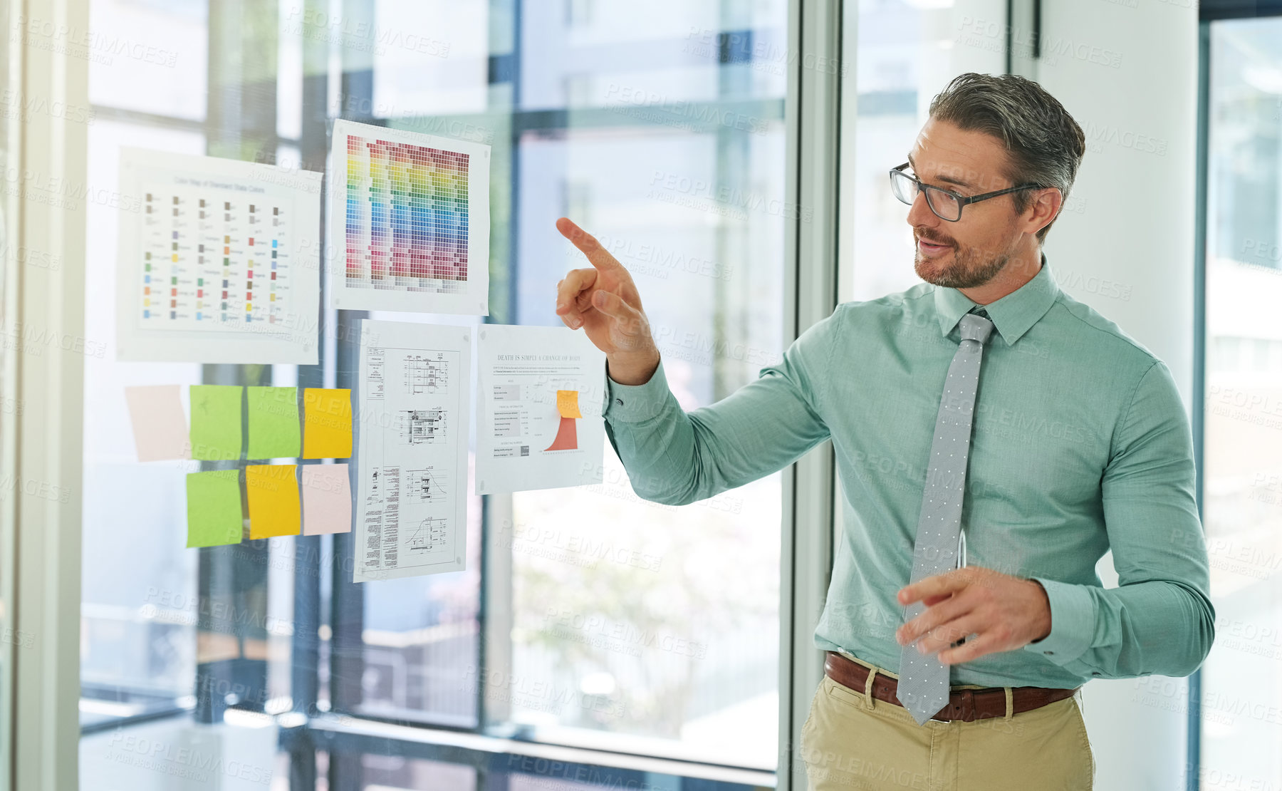 Buy stock photo Cropped shot of a businessman giving a presentation in the boardroom