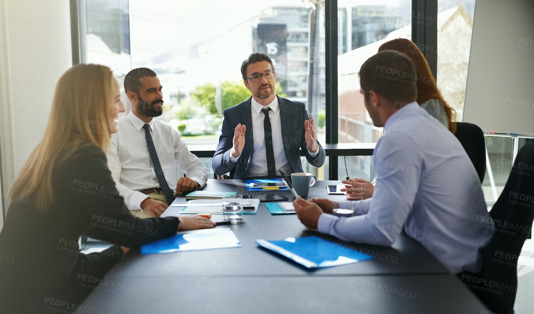 Buy stock photo Cropped shot of businesspeople in a meeting