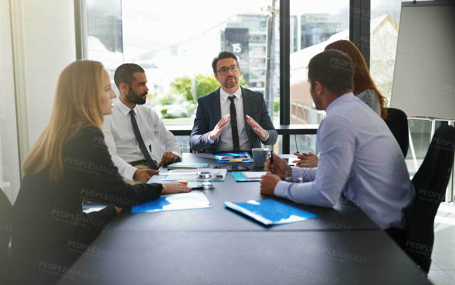 Buy stock photo Cropped shot of businesspeople in a meeting